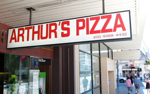 The upside-down sign outside Arthur's Pizza in Paddington